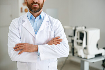 Close up of ophthalmologist on the background of professional ophthalmic equipment