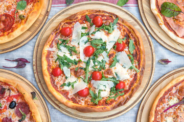 Delicious pizza Caesar style with white sauce, chicken, parmesan, egg, cherry tomatoes and fresh lettuce