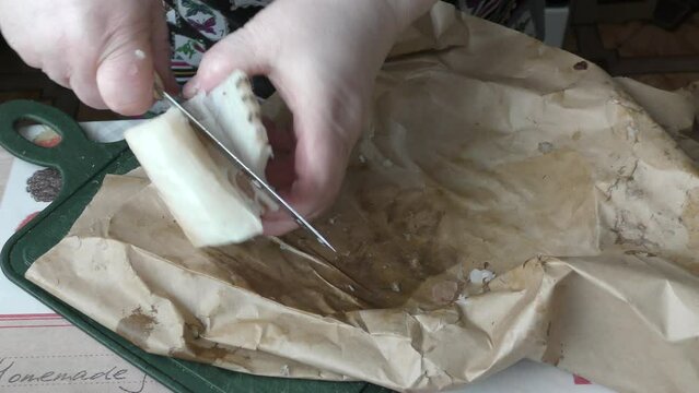 the cook cuts into pieces sea fish cod