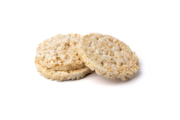Pile of three healthy puffed rice cakes isolated on white background
