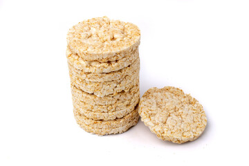 Pile of healthy puffed rice cakes isolated on white background