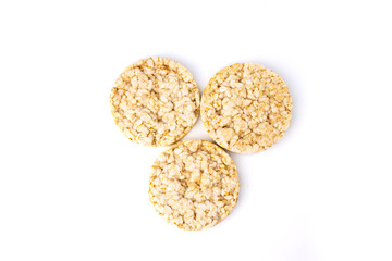 Three healthy puffed rice cakes isolated on white background