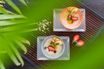 Healthy breakfast in a bowl with homemade baked granola, fresh strawberries
