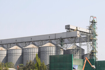 Heavy machinery is moving agricultural materials and equipment to deliver industrial plants and ships transported in rivers for production to industrial factories for processing in Thailand.