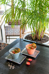 Healthy breakfast in a bowl with homemade baked granola, fresh strawberries