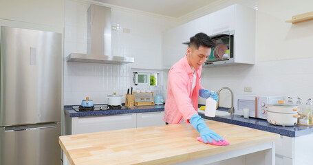 man clean and disinfect kitchen