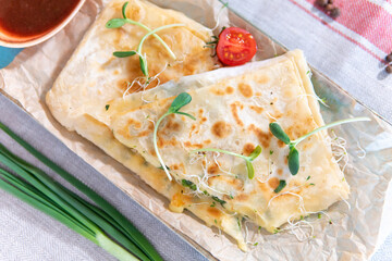 Lavash with cheese, ketchup and green