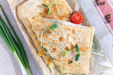 Lavash with cheese, ketchup and green
