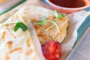 Lavash with cheese, ketchup and green