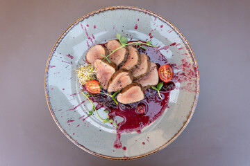 Meat in lingonberry sauce