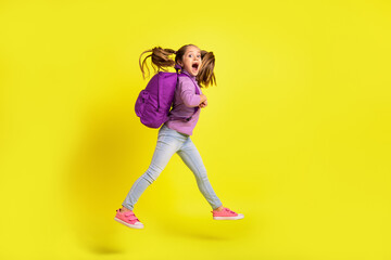 Full length profile side photo of amazed schoolkid jump go fast rush discounts isolated vivid color background