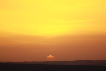 sunset over the road and city