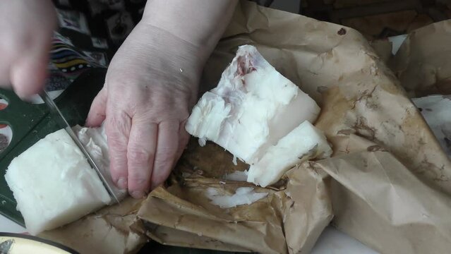 the cook cuts into pieces sea fish cod