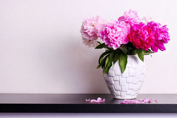 Fototapeta premium Bouquet of colorful peonies in vase