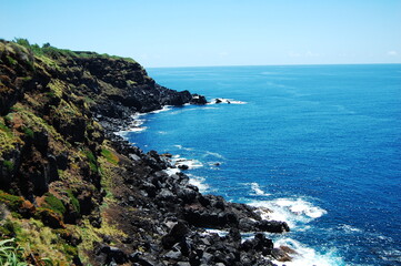 Fototapeta na wymiar Rocky Azores coast with blue sea and clear sky