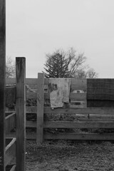 old wooden fence with dirty laundry in black and white 