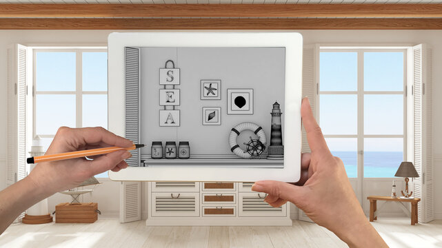 Hands holding and drawing on tablet showing cover living room, marine style, details CAD sketch. Real finished interior in the background, architecture design presentation