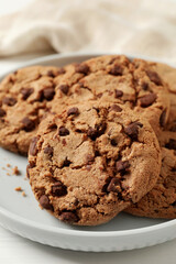 Delicious chocolate chip cookies on plate, closeup