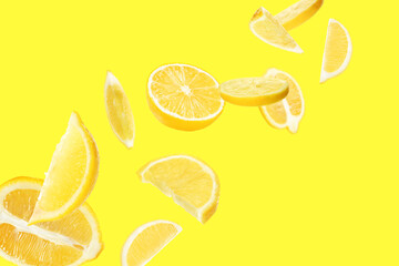 Fresh ripe lemons flying on yellow background