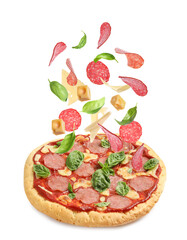 Delicious pizza and flying ingredients on white background