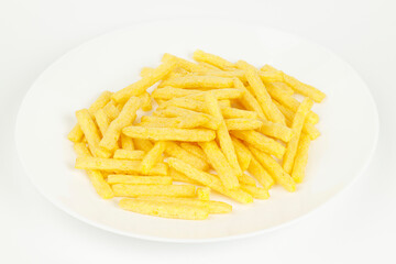 French fries on a white plate, fatty fast food.