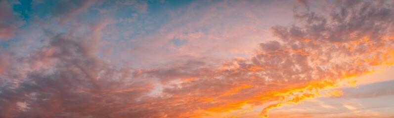 Abstract nature sky, bright colorful clouds, Dramatic sunset cloudscape. Meteorology, heaven, peace, graphic resources, picturesque panoramic scenery. Yellow orange pink cloudy skyline panorama
