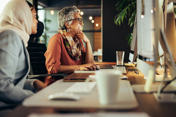 Businesswomen working at their desks in an office