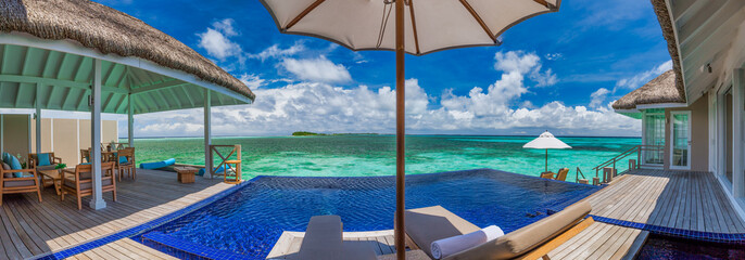 Luxury swimming pool and blue lagoon water, tropical resort with beautiful sea sky view. Ultra wide...