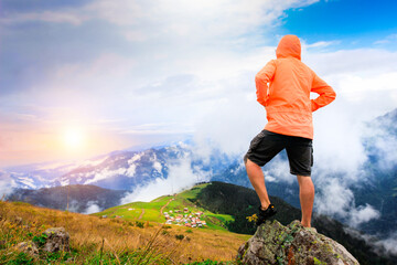 Colorful traditional wooden plateau house, green nature and snowy mountains. Photo was taken at Gito Plateau, Rize, northeastern Karadeniz (Black Sea) region of Turkey
