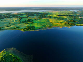 Lake in rural land. Freshwater Lakes. Water supply problems and water deficit. Surface and groundwater pollution. Global drought crisis. Drink water safe. Lake at countryside with green farm field.