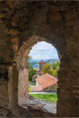 Old monastery complex located in scenic highlands on sunny day in Kakheti