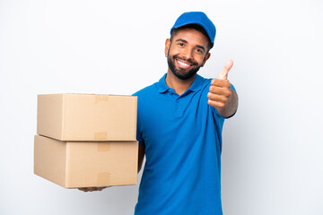 Delivery Brazilian man isolated on white background with thumbs up because something good has happened