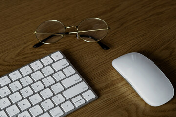 Desktop and computers. Office place. Computer, keyboard, glasses. Working atmosphere. Computer with chroma key.