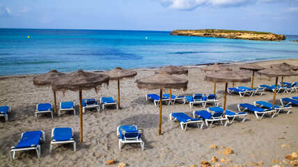 beach chairs and umbrellas on the beach, Menorca, balearic 