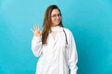 Middle age Brazilian doctor woman isolated on blue background happy and counting four with fingers