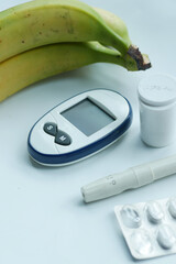 Close up of diabetic measurement tools and pills on color background 