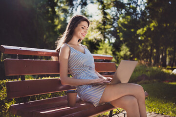 Photo of cheerful cute college student female studying distantly drinking warm coffee sit bench relaxing outdoors