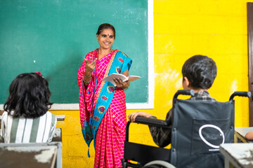 Teacher at elementary class teaching to diverse students at school - concept of education, professional occupation and back to school