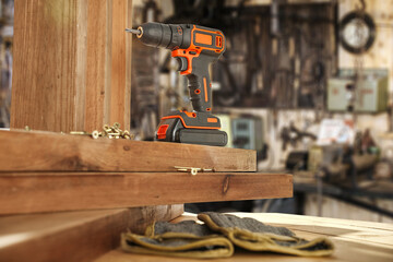 Screwdriver on table and worhop interior. Free space for your decoration. 