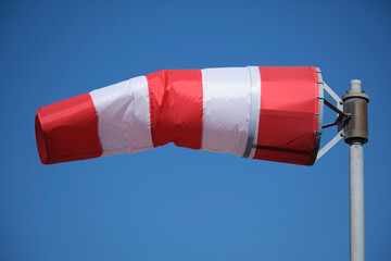 Windsock indicator of wind on runway airport.