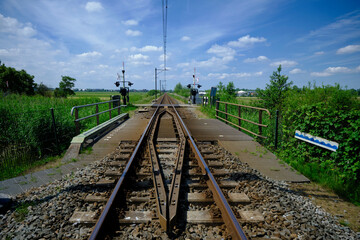 railroad crossing between the meadows in the Netherlands
