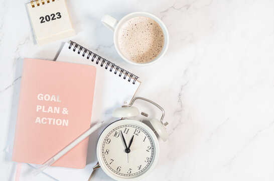 Calendar 2023 And Alarm Clock On Office Table. To-do List And Plan For Next Year. Flatlay Composition