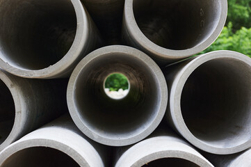 Concrete pipes to replace the city sewer system. Pipes view from the end to the lumen