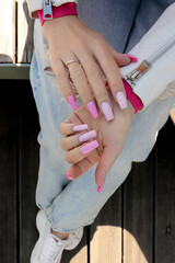 Pink multicolored manicure on nails.