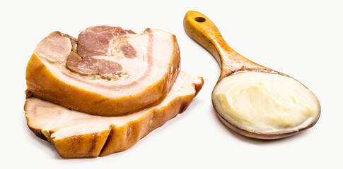 pork fat lard, pork fat used as a Brazilian culinary ingredient, bacon and sausage in the background