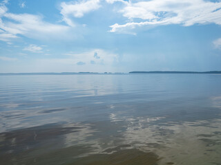 Onega Lake in a calm weather in summer on a sunny day. Karelia, Northwest Russia