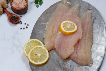 Fresh Pangasius dory Fish Fillet with ingredient on white background