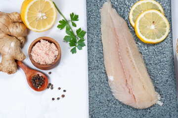 Fresh Pangasius dory Fish Fillet with ingredient on white background