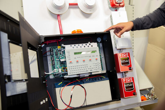 Fire alarm system attached to a white wall used for training