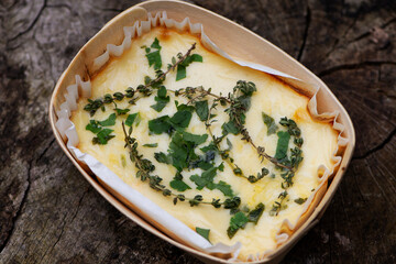 lasagna, pasta with beef and cheese in a package on a wooden background